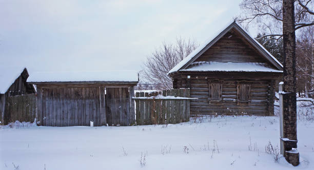 istock log abandoned house in winter 1301743405