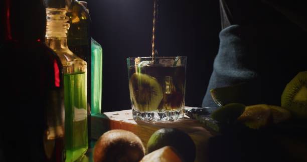 istock Making a cocktail with fresh kiwi fruit, lime and orange 1301744636
