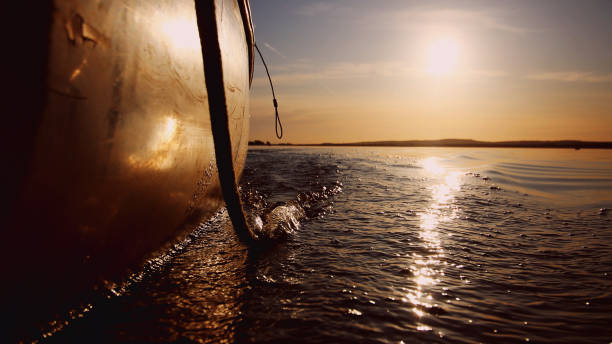 Ship yachts in the river during amazing sunset. Sailing concept