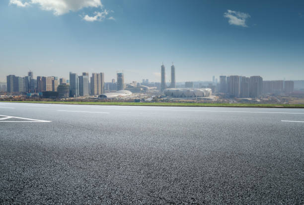 Asphalt highway skyline and modern building landscape