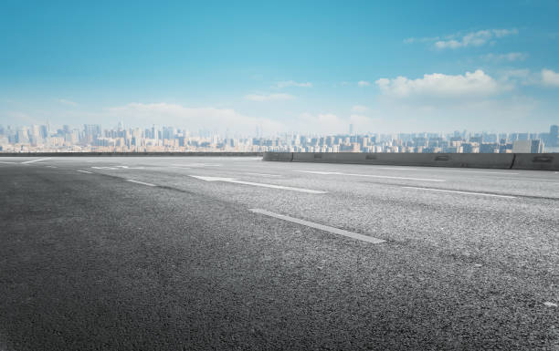 istock Asphalt highway skyline and modern building landscape 1301745956