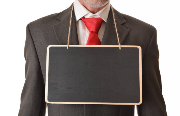 istock Businessman with empty banner hanging from neck 1301748717
