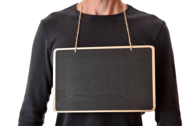 Man in black sweater with empty banner hanging from neck