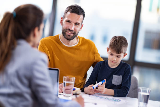 istock Happy single father and his son having a counseling session. 1301749574