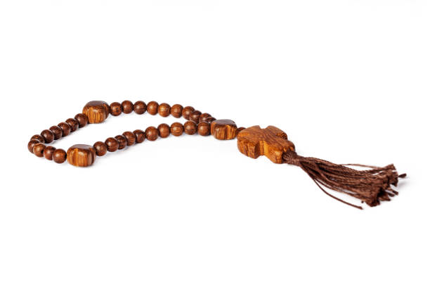 istock Rosary wooden beads on white background 1301749831