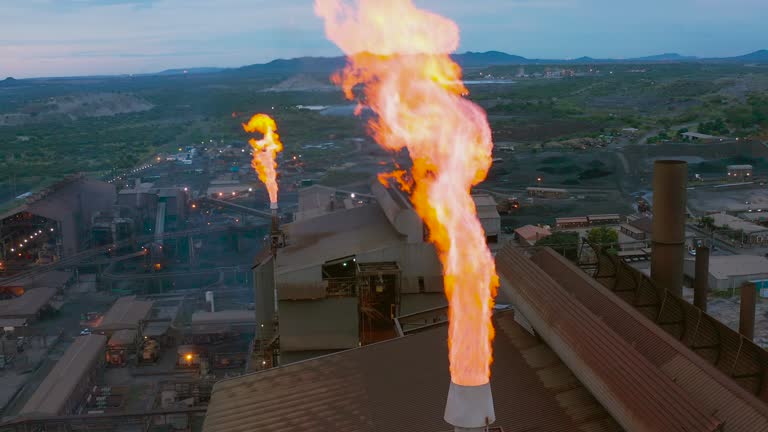 Pollution. Climate Change. Environmental damage.Aerial view of a gas flare stack burning off dangerous gases from a mine