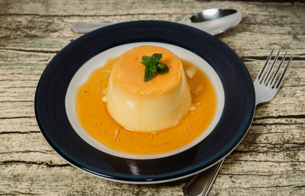 istock Delicious typical dessert from South America called Flan, made with eggs, milk, vanilla and flavored with caramel. 1301754396