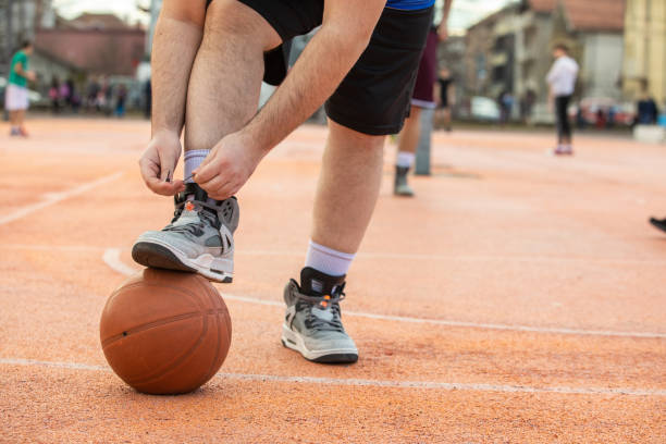 istock Young man tying shoelace and getting ready for a game 1301754768