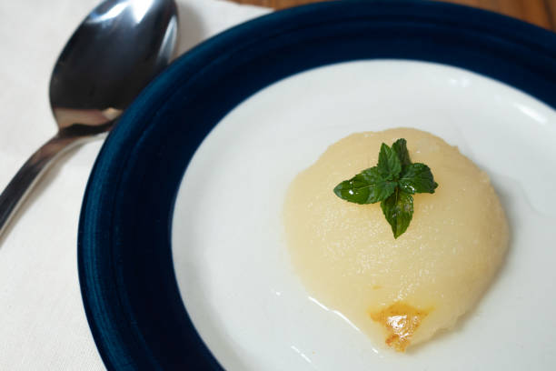 istock Fresh half Pears Served with sweet syrup and mint leaves. 1301754854