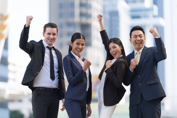 istock Business team standing in front of modern office 1301754945