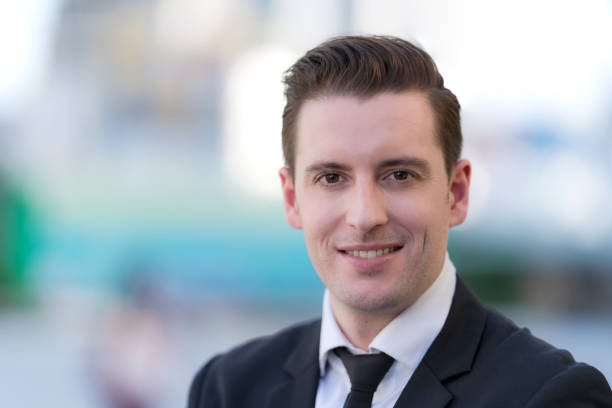 istock Close up of Smiling businessman 1301756474