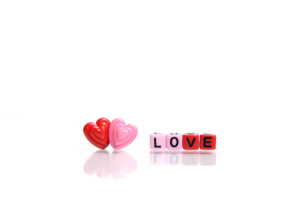 istock Red and pink heart shape with LOVE word beads. Romance concept 1301757652