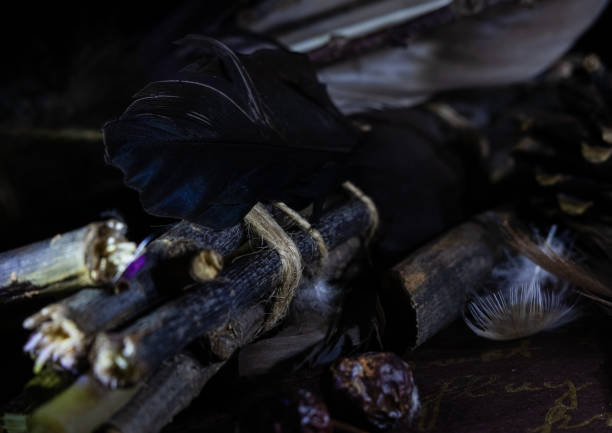 istock mystical composition for the ritual of branches, feathers and tied with a rope 1301758006