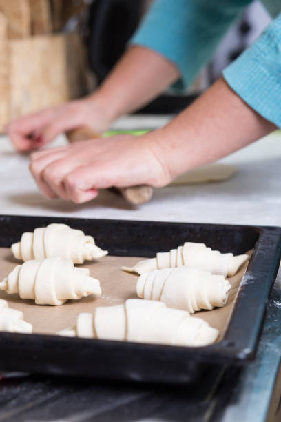 istock Working with puff pastry. Making croissants on a home kitchen 1301758680
