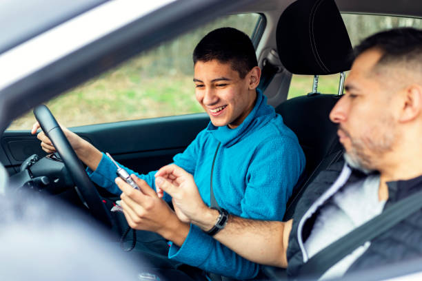 istock Teenage boy having driving lesson with male instructor 1301758925