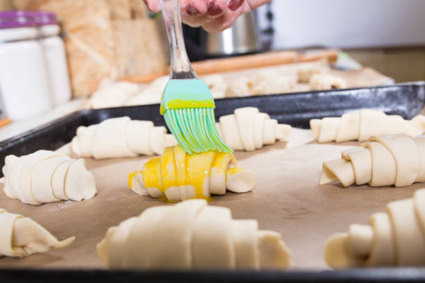 istock Pastry brush. Making croissants. Sweet buns ready to bake 1301758932