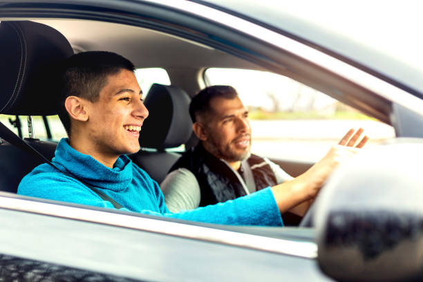 istock Teenage boy having driving lesson with male instructor 1301759006