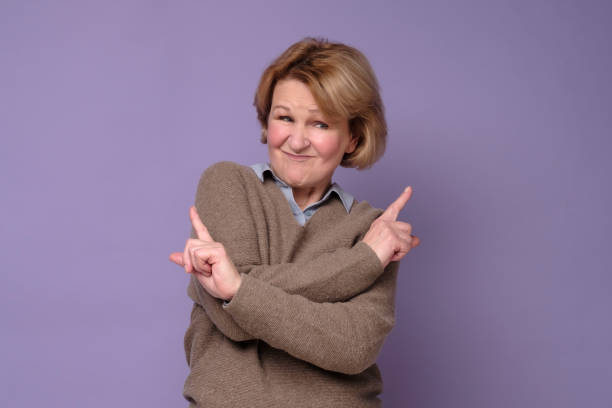 istock Woman filled with hesitations and doubts, points with finger in different sides 1301759031