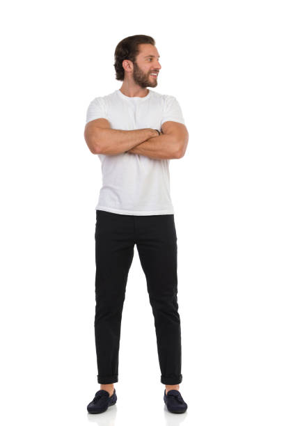 istock Handsome Man Is Standing With Arms Crossed And Looking Away. Front View. 1301759069