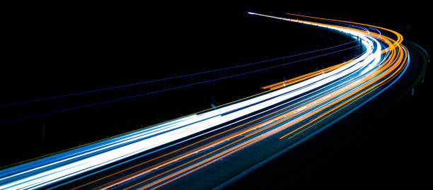 istock lights of cars with night. long exposure 1301760121