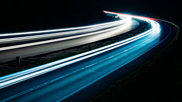 istock lights of cars with night. long exposure 1301760143