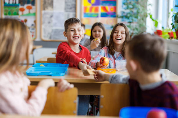 istock Children share food in the classroom 1301760518