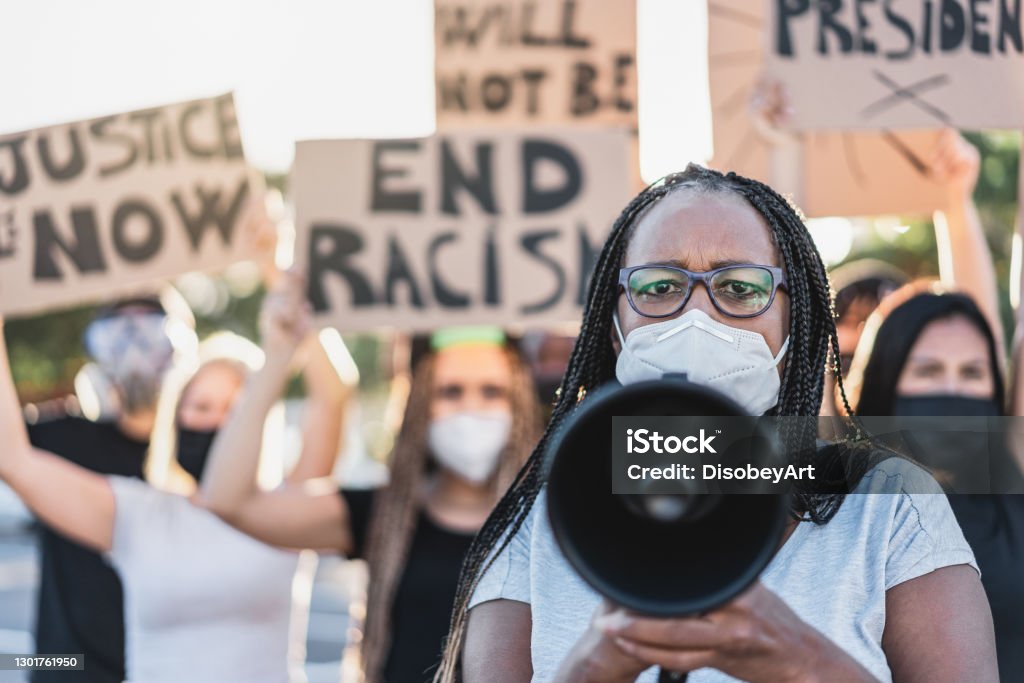 Group of demonstrators on road from different cultures protest for equal rights - Focus on african senior woman Anti-racism Stock Photo