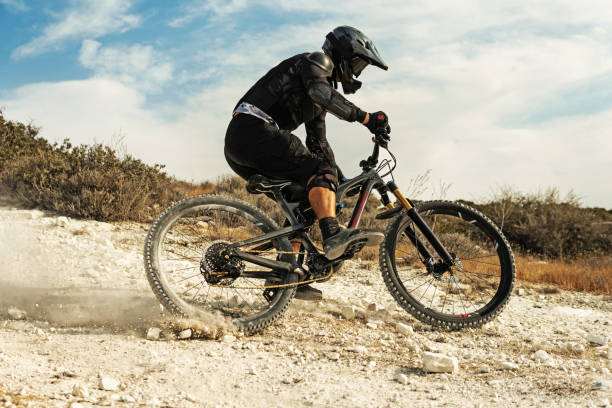 istock Rider fully equipped with protective gear during downhill ride on his bicycle 1301762877