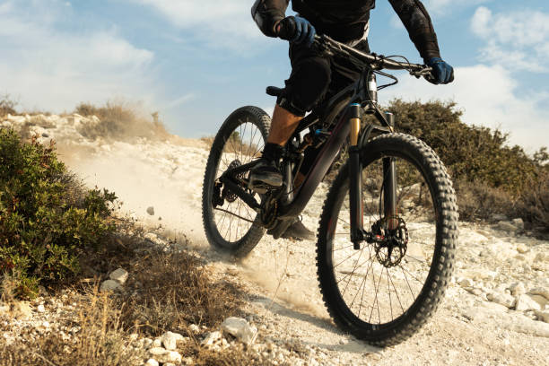 istock Rider fully equipped with protective gear during downhill ride on his bicycle 1301762953