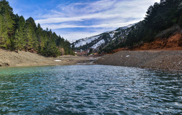 istock Snowy mountain and pond view 1301763147