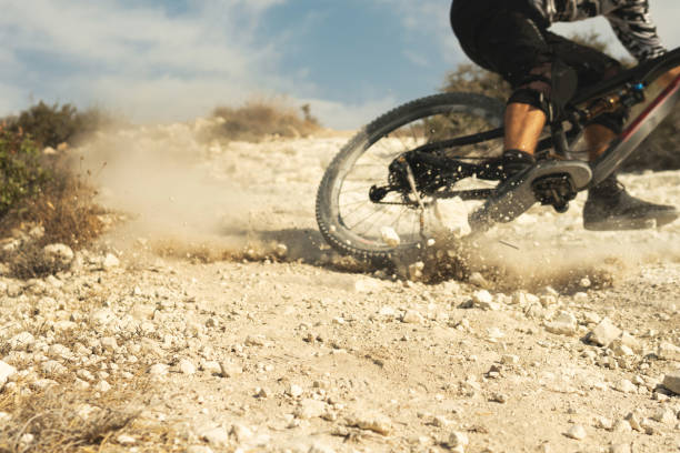 istock Professional bike rider during downhill ride on his bicycle 1301763389
