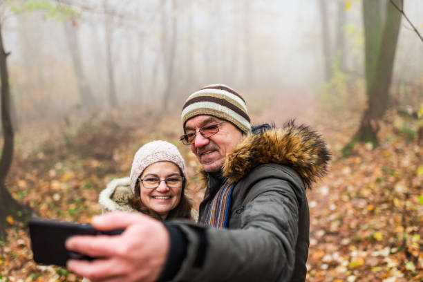 istock Senior couple capturing relaxing moments in nature 1301766018