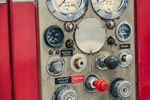 Close-up of a fire truck's many dials and mechanism for fighting fires