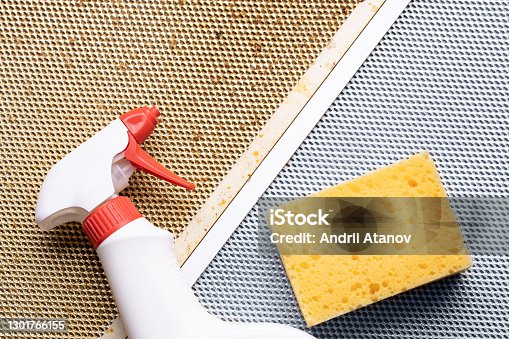 istock cleaning dirty clogged cooker hood filter from domestic kitchen. dirty and new clean filter. above view 1301766155