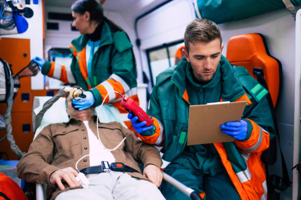 istock Doctors emergency or paramedics are working with a senior man patient while he lies on a stretcher in an ambulance. 1301767064