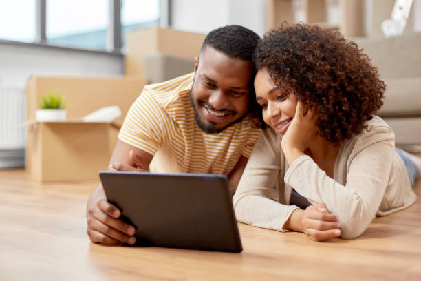 istock happy couple with tablet pc computer at new home 1301767294