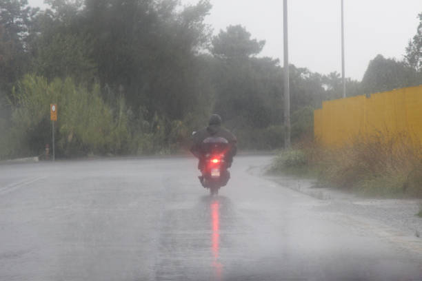 istock motorcyclist by the bad weather 1301767797