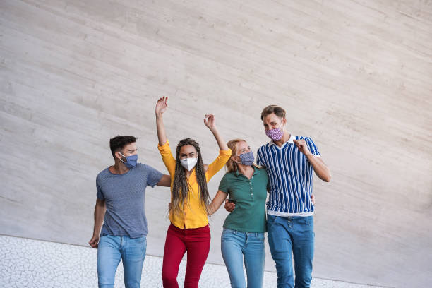 istock Young happy people dancing and having fun during coronavirus outbreak - Focus on faces 1301768647