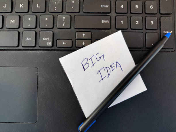 istock A White sticky note with text BIG IDEA and pen on top of laptop keyboard 1301770355