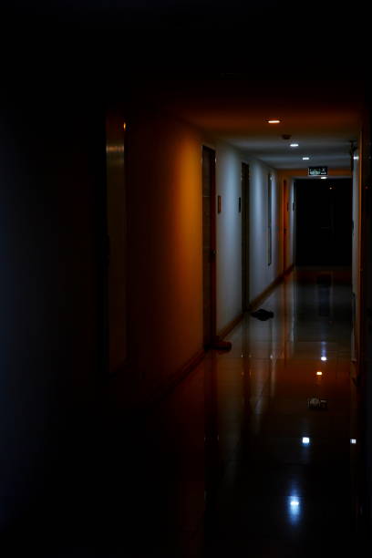 istock Dark corridor of condo at night 1301771264