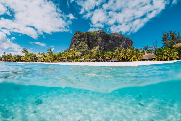 Tropical transparent ocean with Le Morne mountain and luxury beach in Mauritius. Split view.