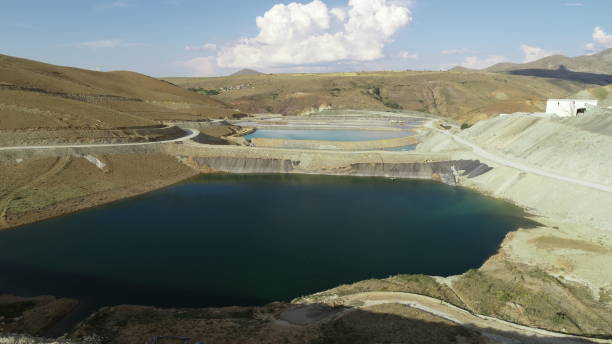 istock Flooded open pit chromium chrome ore quarry mine with blue water Sivas Kangal Turkey 1301772523