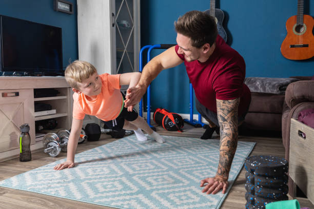 istock Family Doing Home Workout Online-Kurs, Father and his son 1301773148