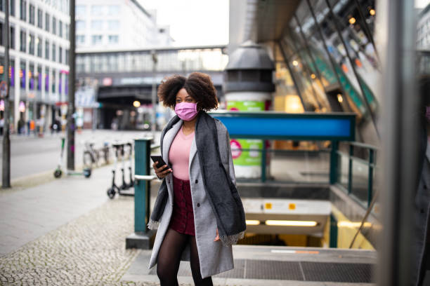 istock African female commuting during Covid-19 pandemic 1301773306