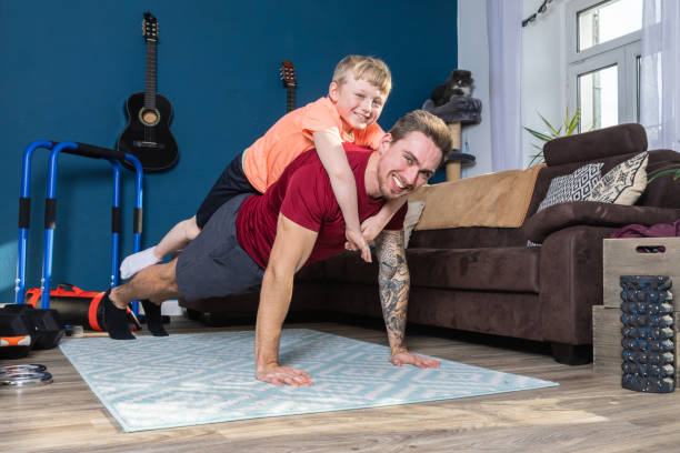 istock Family Doing Home Workout Online-Kurs, Father and his son 1301774218