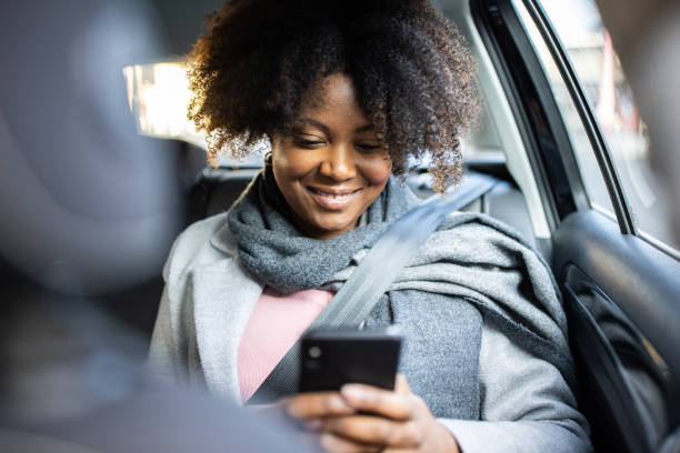 istock Businesswoman traveling to work in a cab 1301774238
