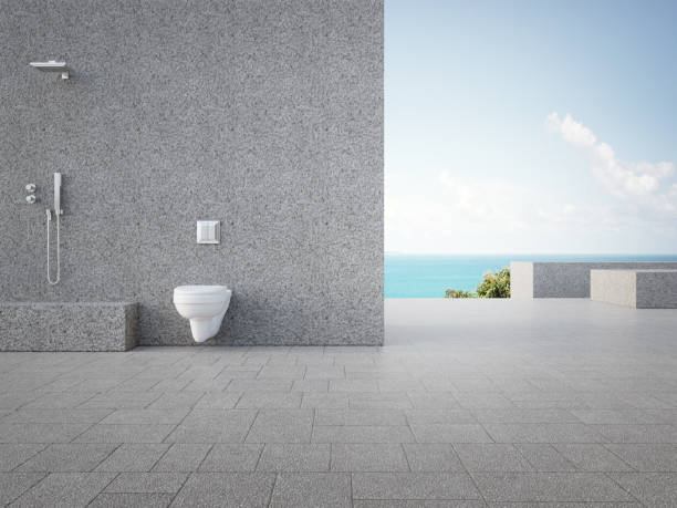 istock Gray concrete wall with outdoor shower. 1301775208