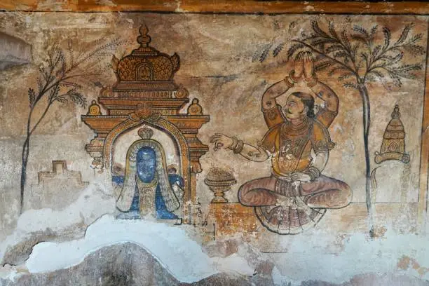 Ancient multi-colored paintings drawn on the complex walls in the historical temples. Carving of Maratha paintings on the wall of the temple.