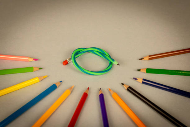 istock Multicolor pencils and flexible pencil on a light background. Close up. Selective focus. 1301776795