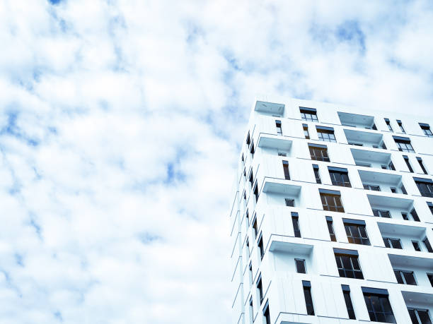 istock Image of a new building with cloudy sky background. 1301776800